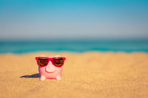 Piggybank on the beach in summer
