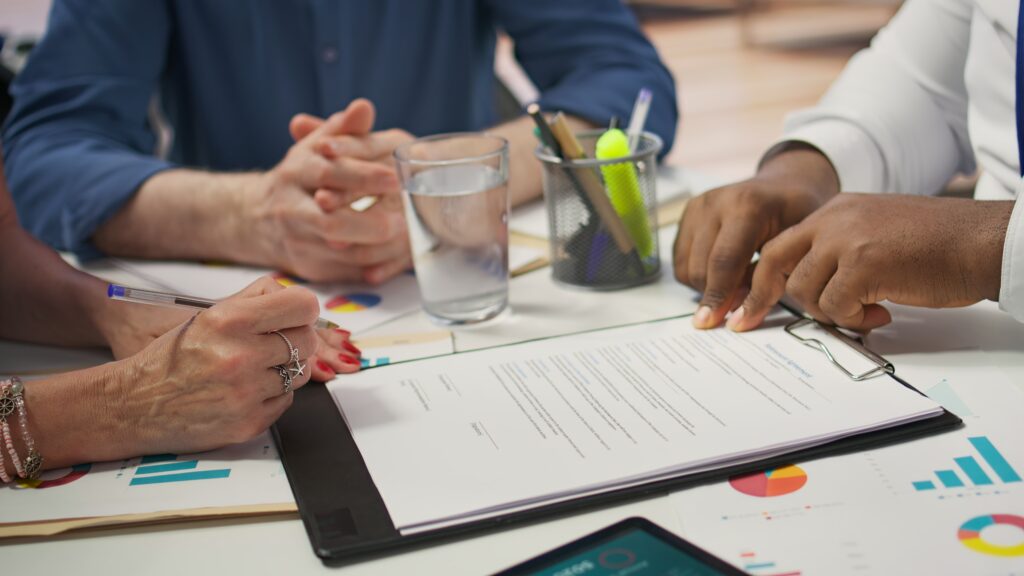Executives reviewing documents during a corporate brand video interview in Washington, DC