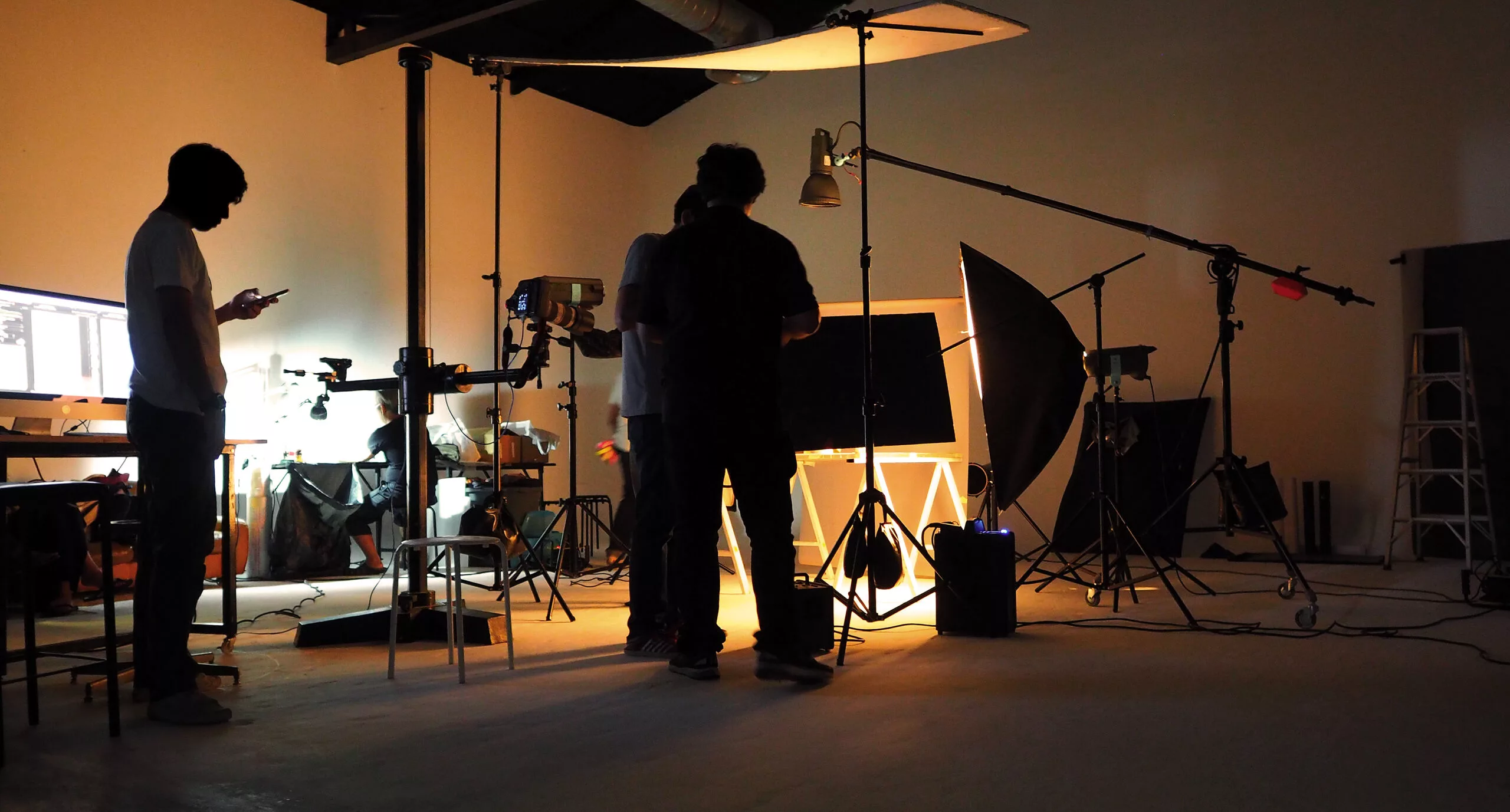 Film crew setting up lighting for a brand video interview in Washington, DC